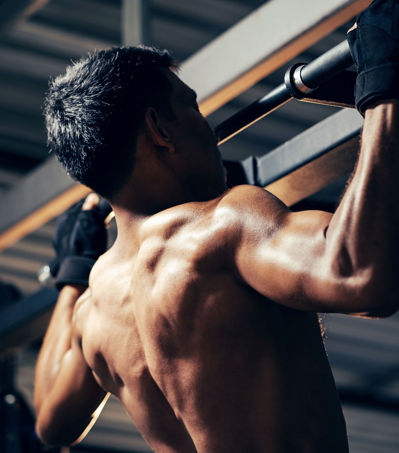 Back Of Head View Of Man Doing Pull Up