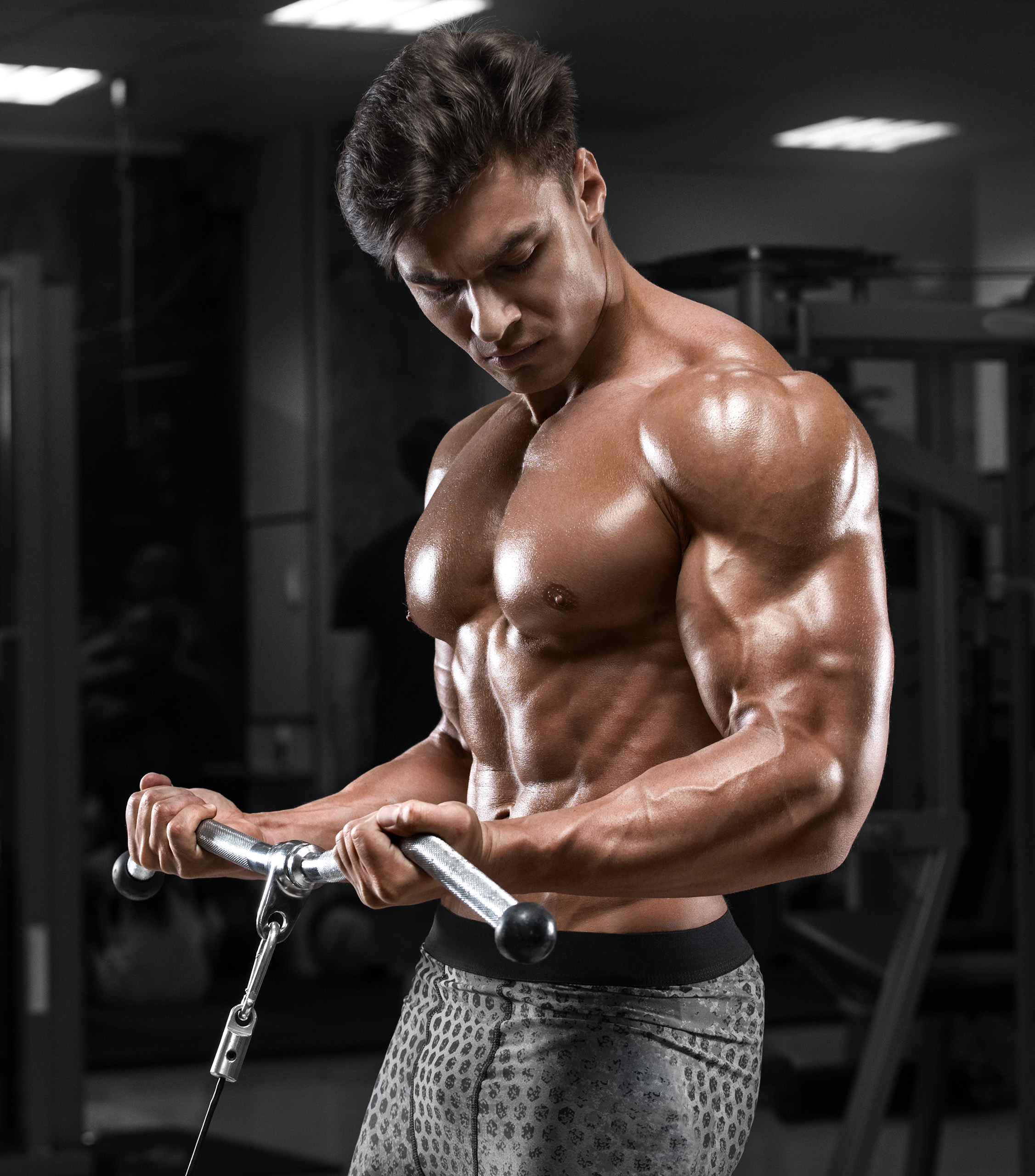 Muscular Guy Doing Tricep Pull Ups