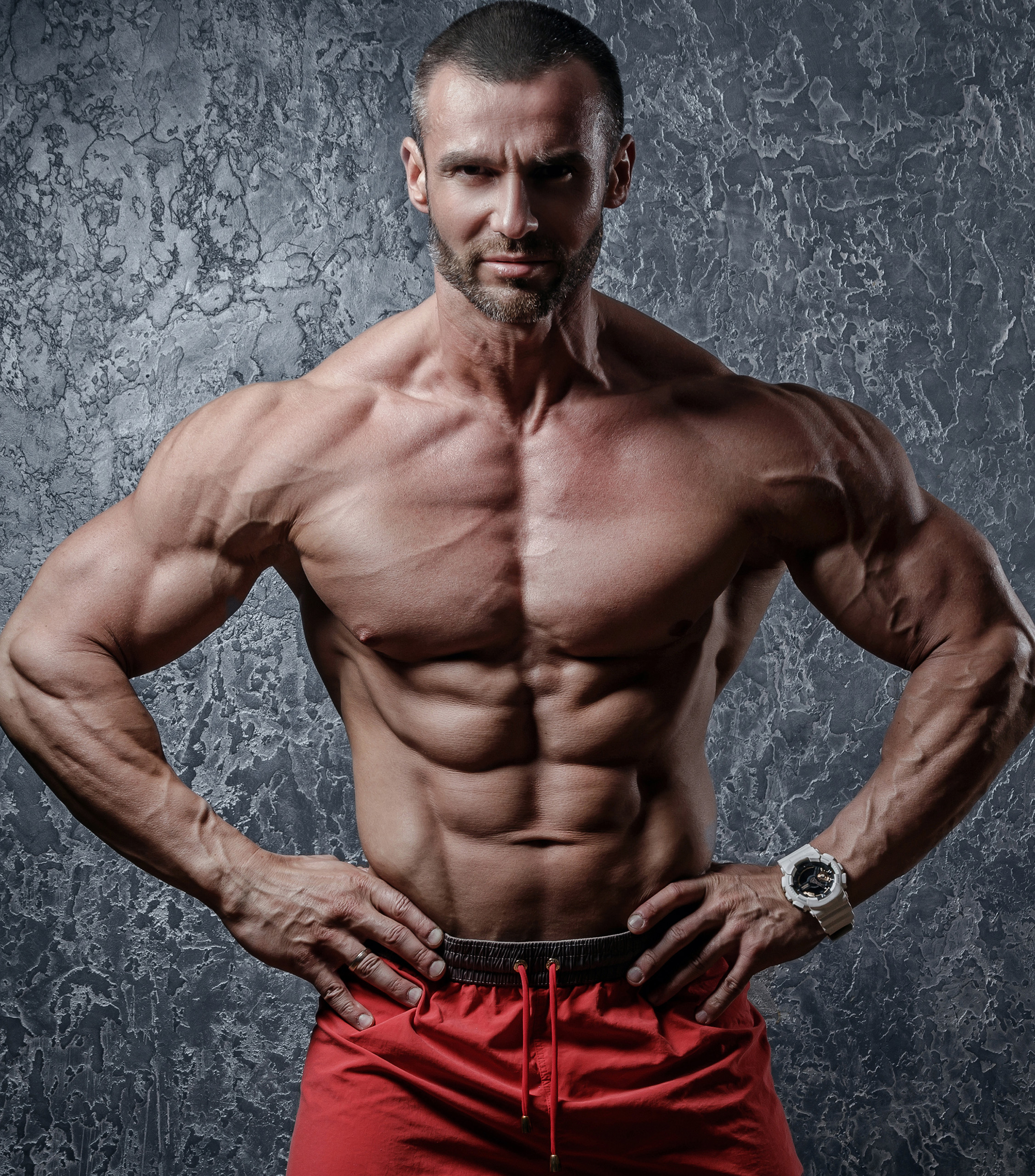 Muscular Guy With Abs Posing in Red Shorts