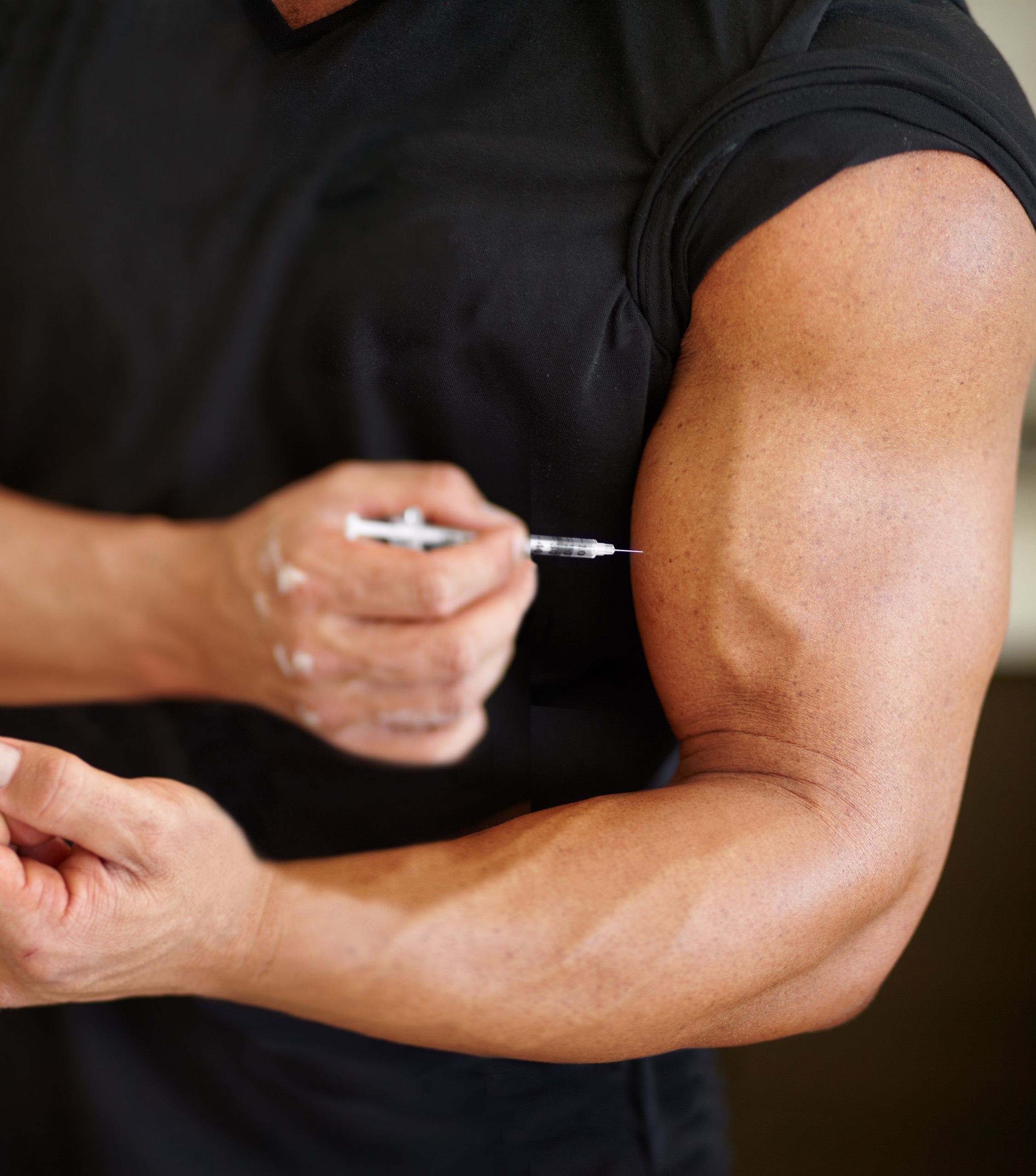 Muscular Guy in Black Shirt Giving Himself an Injection