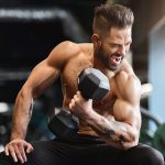 Muscular Guy Doing Bicep Curls